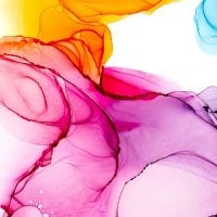 art 2 - fundsforNGOs Abstract splash of vibrant pink, purple, orange, and blue ink flowing in water, forming swirling shapes.