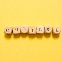 culture - fundsforNGOs Wooden letter blocks spell out 'CULTURE' on a bright yellow background