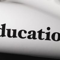 education and sports for children 2 - fundsforNGOs Close-up of the word 'Education' printed in bold on a curved white surface.