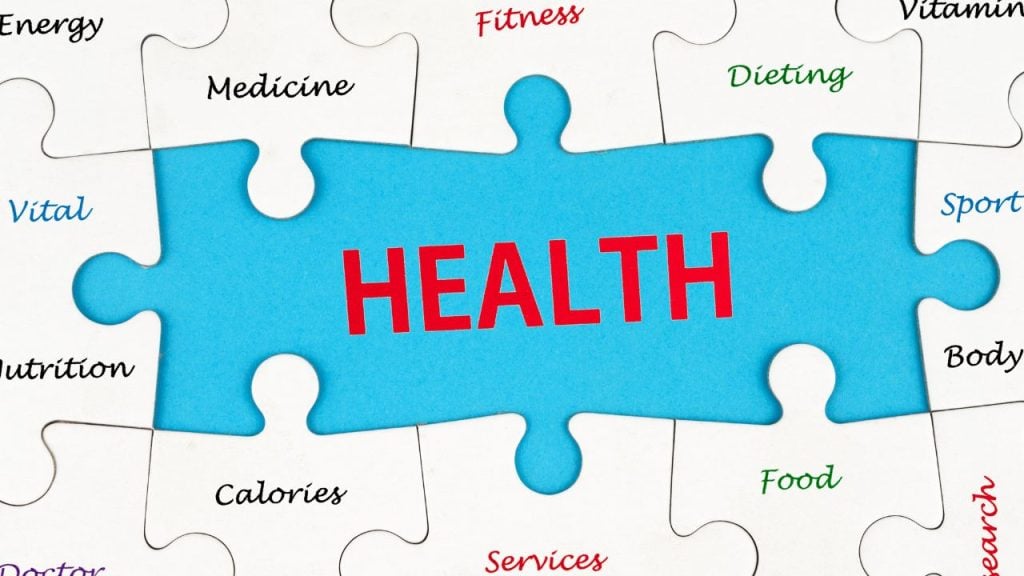 Blue puzzle piece with 'HEALTH' in red at center, surrounded by white puzzle pieces labeled with health terms (Medicine, Fitness, Dieting, Vitamins, Nutrition, Calories, Food, Energy, Sport, Body, Services).