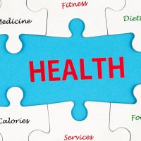 Blue puzzle piece with 'HEALTH' in red at center, surrounded by white puzzle pieces labeled with health terms (Medicine, Fitness, Dieting, Vitamins, Nutrition, Calories, Food, Energy, Sport, Body, Services).