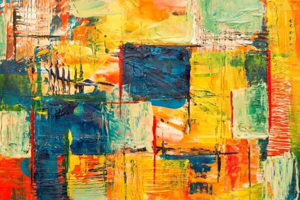 Abstract acrylic painting with bold overlapping blocks of orange, yellow, blue and green and textured brushstrokes.