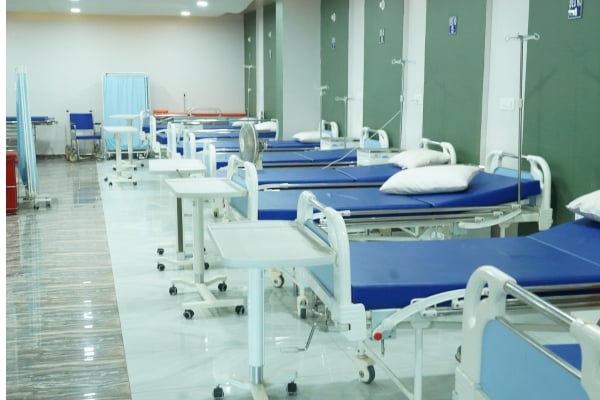 Marine Conservation 11 - fundsforNGOs Row of hospital beds with blue mattresses in a clean ward, each with pillows and bedside tables and wheeled carts nearby