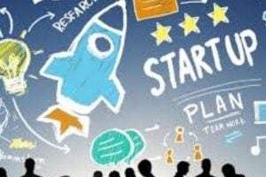 Colorful startup-themed illustration with a blue rocket, stars, lightbulb, and crowd silhouettes, symbolizing entrepreneurship.