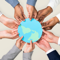 Diverse hands join around a blue globe, symbolizing global cooperation and unity.