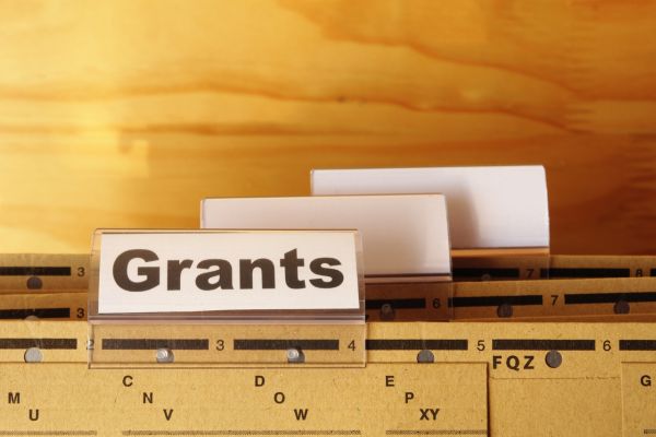 grant 1 - fundsforNGOs Label reading 'Grants' on a filing cabinet drawer with blank index tabs nearby.