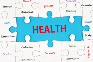 Blue puzzle piece labeled HEALTH surrounded by white puzzle pieces with health terms (Medicine, Nutrition, Fitness, Dieting, Calories, Food, Heart, Vitamin).