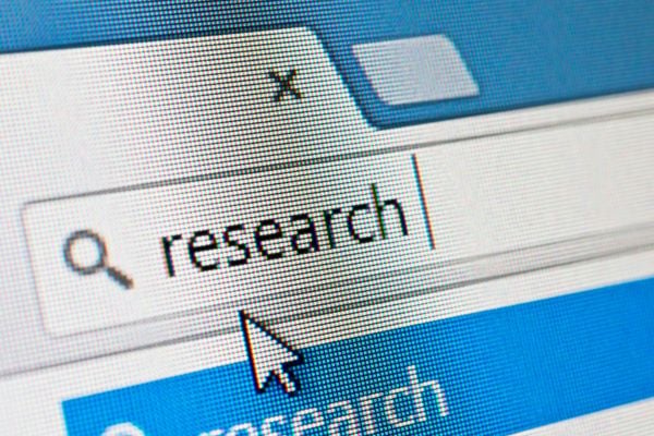 Web browser search field with a magnifying glass icon and the word 'research', with the cursor pointing at the field.